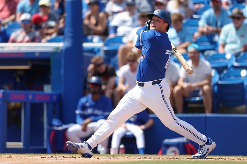 Mar 20, 2025; Dunedin, Florida, USA; Toronto Blue Jays third baseman Will Wagner (7) doubles against the Tampa Bay Rays in the second inning during spring training at TD Ballpark. Mandatory Credit: Nathan Ray Seebeck-Imagn Images