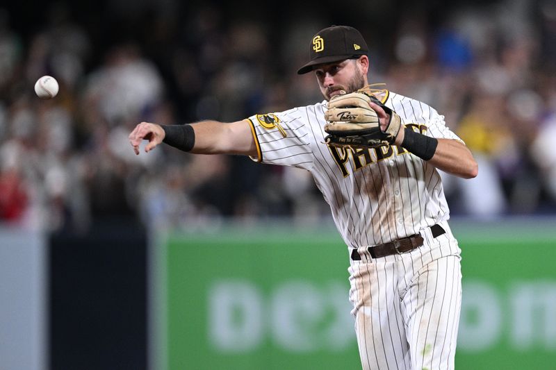 Jul 8, 2023; San Diego, California, USA; San Diego Padres second baseman Matthew Batten (17) throws to first base on a ground out by New York Mets second baseman Jeff McNeil (not pictured) to end the game at Petco Park. Mandatory Credit: Orlando Ramirez-USA TODAY Sports