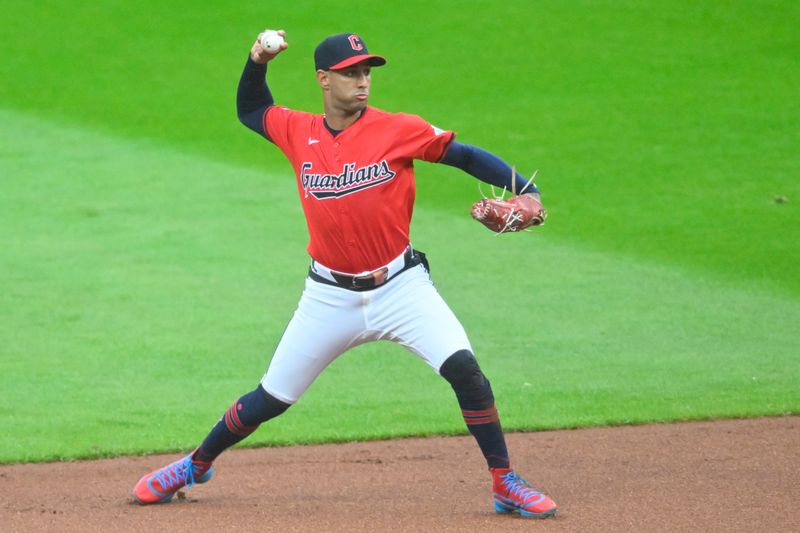 Apr 23, 2024; Cleveland, Ohio, USA; Cleveland Guardians shortstop Brayan Rocchio (4) throws to first base in the first inning against the Boston Red Sox at Progressive Field. Mandatory Credit: David Richard-USA TODAY Sports