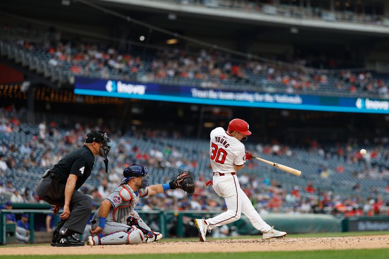 Jun 5, 2024; Washington, District of Columbia, USA; Washington Nationals outfielder Jacob Young (30) singles against the New York Mets during the third inning at Nationals Park. Mandatory Credit: Geoff Burke-USA TODAY Sports