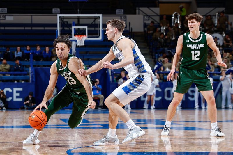 Feb 7, 2023; Colorado Springs, Colorado, USA; Colorado State Rams guard Isaiah Rivera (23) drives to the net against Air Force Falcons guard Camden Vander Zwaag (30) as forward Patrick Cartier (12) looks on in the first half at Clune Arena. Mandatory Credit: Isaiah J. Downing-USA TODAY Sports