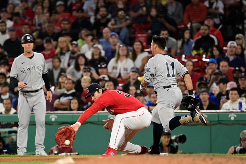 Sep 14, 2023; Boston, Massachusetts, USA; New York Yankees shortstop Anthony Volpe (11) is called safe as Boston Red Sox first baseman Triston Casas (36) makes a catch during the eighth inning at Fenway Park. Mandatory Credit: Eric Canha-USA TODAY Sports