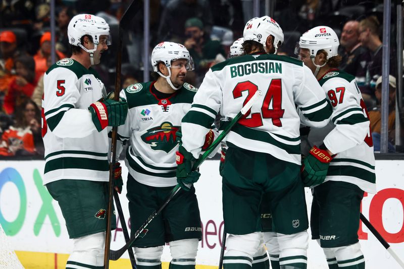 Nov 8, 2024; Anaheim, California, USA; Minnesota Wild center Marco Rossi (23) celebrates with his teammates after a goal during the third period of a hockey game against the Anaheim Ducks at Honda Center. Mandatory Credit: Jessica Alcheh-Imagn Images