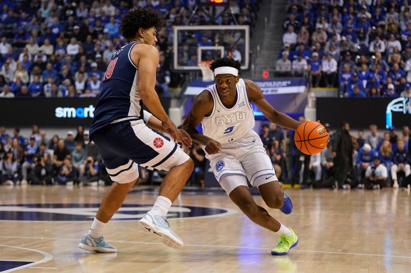 Jan 26, 2026; Provo, Utah, USA; BYU Cougars forward AJ Dybantsa (3) drives while being defended by Arizona Wildcats forward Koa Peat (10) during the first half at Marriott Center. Mandatory Credit: Aaron Baker-Imagn Images 