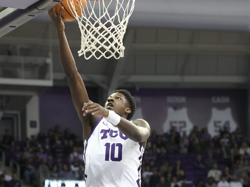 Jan 14, 2023; Fort Worth, Texas, USA;  TCU Horned Frogs guard Damion Baugh (10) shoots past Kansas State Wildcats guard Markquis Nowell (1) during the first half at Ed and Rae Schollmaier Arena. Mandatory Credit: Kevin Jairaj-USA TODAY Sports