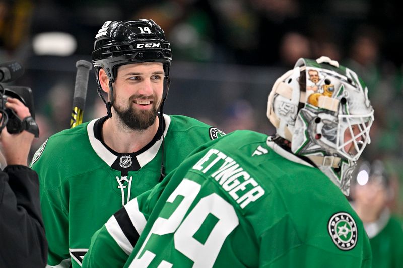 Jan 31, 2025; Dallas, Texas, USA; Dallas Stars goaltender Jake Oettinger (29) and Stars left wing Jamie Benn (14) celebrate on the ice after the Stars defeat the Vancouver Canucks at the American Airlines Center. Mandatory Credit: Jerome Miron-Imagn Images
