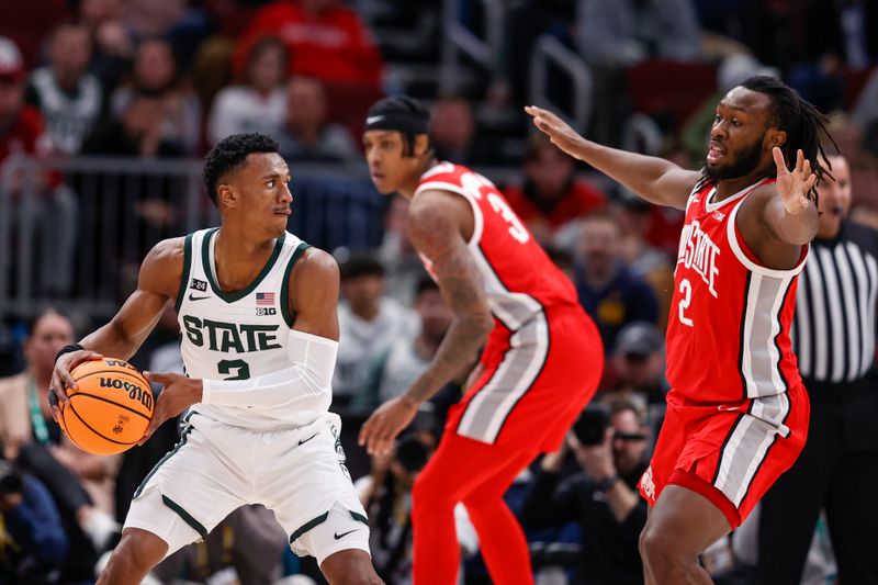 Mar 10, 2023; Chicago, IL, USA; Michigan State Spartans guard Tyson Walker (2) looks to pass the ball against Ohio State Buckeyes guard Bruce Thornton (2) during the first half at United Center. Mandatory Credit: Kamil Krzaczynski-USA TODAY Sports