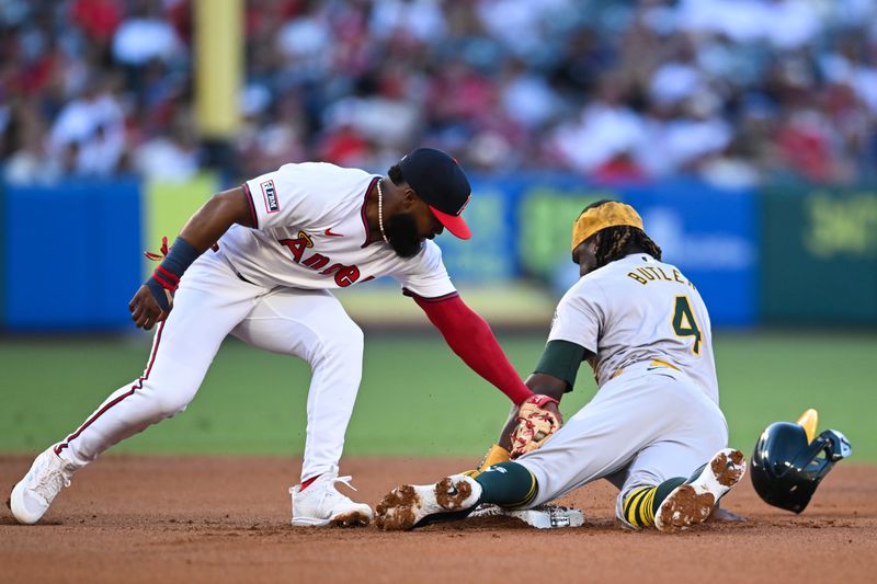 Jul 27, 2024; Anaheim, California, USA; Oakland Athletics outfielder Lawrence Butler (4) steals second base against Los Angeles Angels second baseman Luis Rengifo (2) during the first inning at Angel Stadium. Mandatory Credit: Jonathan Hui-USA TODAY Sports