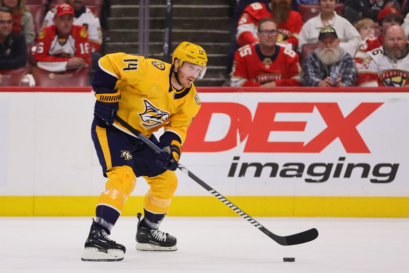 Mar 21, 2024; Sunrise, Florida, USA; Nashville Predators center Gustav Nyquist (14) moves the puck against the Florida Panthers during the first period at Amerant Bank Arena. Mandatory Credit: Sam Navarro-USA TODAY Sports