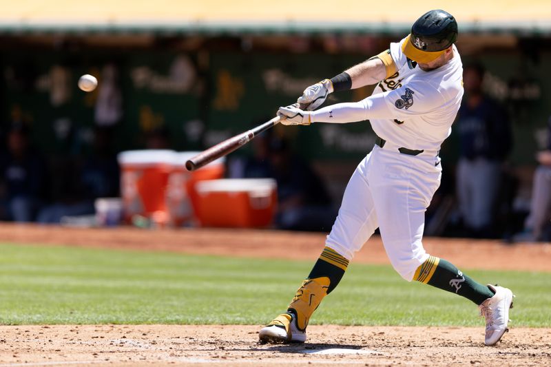 Sep 5, 2024; Oakland, California, USA; Oakland Athletics left fielder Seth Brown (15) hits a solo home run against the Seattle Mariners during the third inning at Oakland-Alameda County Coliseum. Mandatory Credit: D. Ross Cameron-Imagn Images