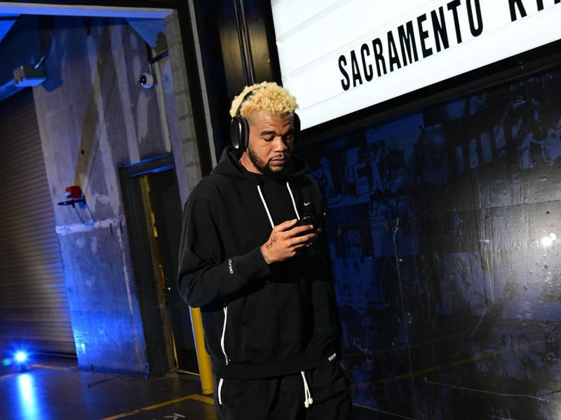 LOS ANGELES, CA - FEBRUARY 25: Mason Jones #22 of the Sacramento Kings arrives to the arena before the game against the LA Clippers on February 25, 2024 at Crypto.Com Arena in Los Angeles, California. NOTE TO USER: User expressly acknowledges and agrees that, by downloading and/or using this Photograph, user is consenting to the terms and conditions of the Getty Images License Agreement. Mandatory Copyright Notice: Copyright 2024 NBAE (Photo by Adam Pantozzi/NBAE via Getty Images)