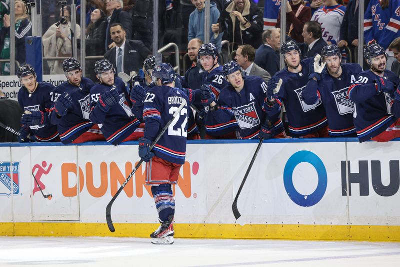 Mar 17, 2024; New York, New York, USA; New York Rangers center Jonny Brodzinski (22) celebrates his goal with teammates during the second period against the New York Islanders at Madison Square Garden. Mandatory Credit: Vincent Carchietta-USA TODAY Sports