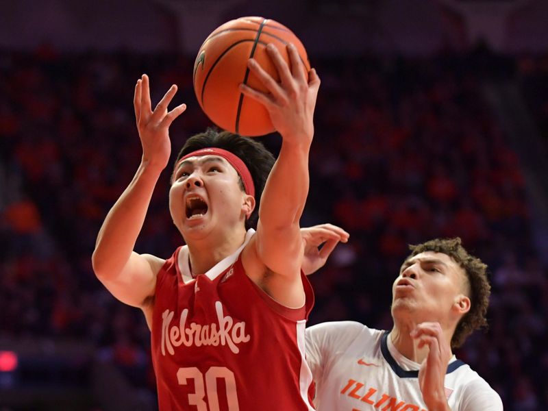 Jan 31, 2023; Champaign, Illinois, USA; Nebraska Cornhuskers guard Keisei Tominaga (30) drives past Illinois Fighting Illini forward Coleman Hawkins (33) during the second half at State Farm Center. Mandatory Credit: Ron Johnson-USA TODAY Sports