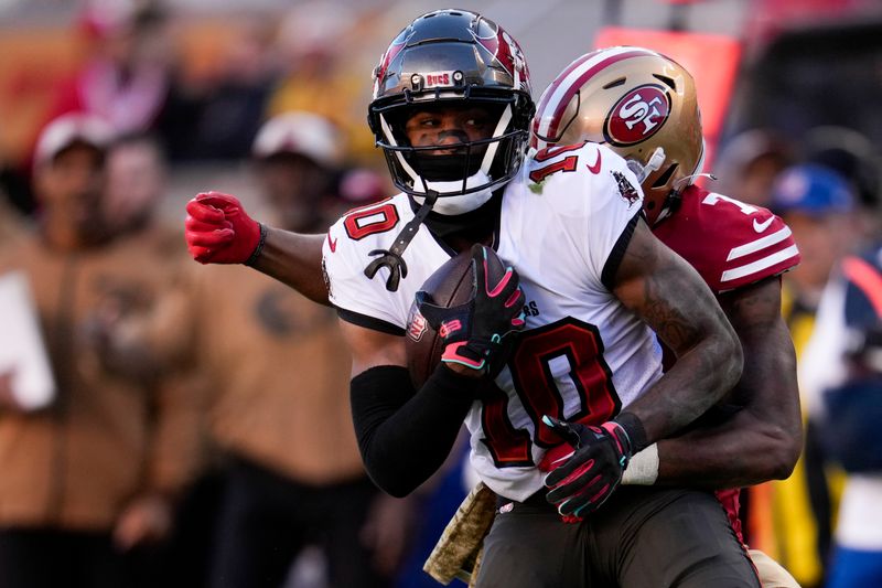 Tampa Bay Buccaneers wide receiver Trey Palmer (10) is tackled by San Francisco 49ers cornerback Charvarius Ward during the second half of an NFL football game Sunday, Nov. 19, 2023, in Santa Clara, Calif. (AP Photo/Godofredo A. Vásquez)