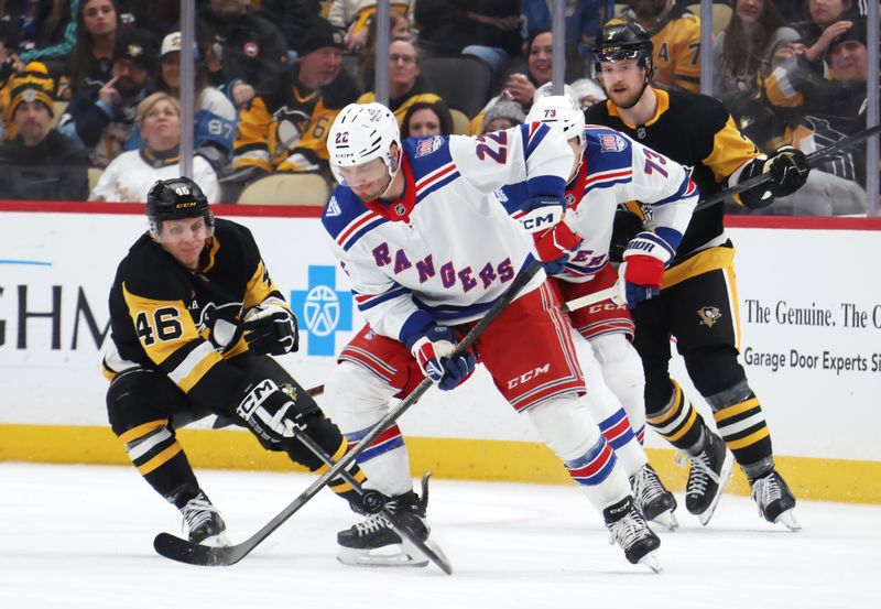 Jan 31, 2026; Pittsburgh, Pennsylvania, USA;  New York Rangers center Jonny Brodzinski (22) handles the puck against Pittsburgh Penguins center Blake Lizotte (46) during the third period at PPG Paints Arena. Mandatory Credit: Charles LeClaire-Imagn Images