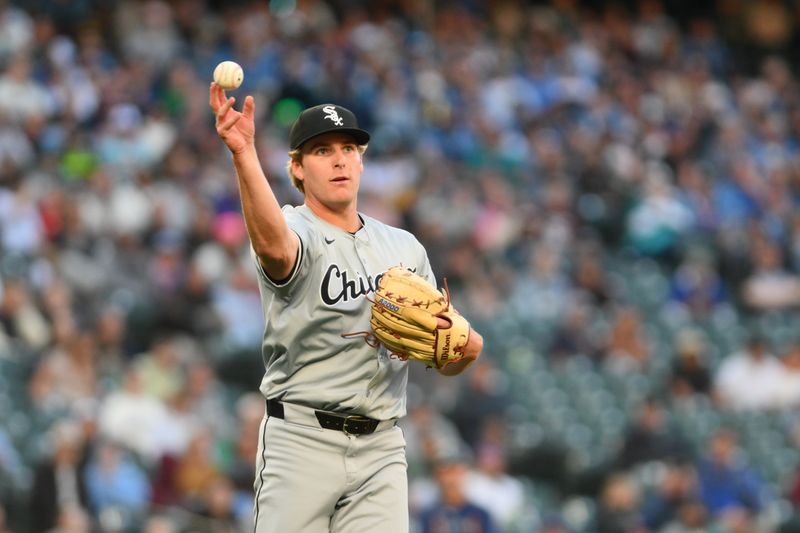 Jun 12, 2024; Seattle, Washington, USA; Chicago White Sox starting pitcher Jonathan Cannon (48) throws the ball to first base during the seventh inning against the Seattle Mariners at T-Mobile Park. Mandatory Credit: Steven Bisig-USA TODAY Sports