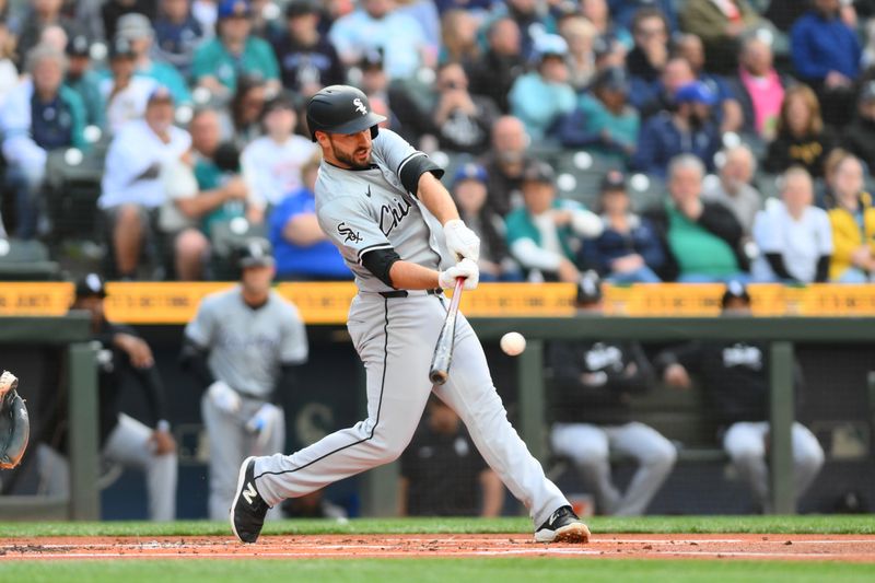 Jun 11, 2024; Seattle, Washington, USA; Chicago White Sox shortstop Paul DeJong (29) hits a single against the Seattle Mariners during the second inning at T-Mobile Park. Mandatory Credit: Steven Bisig-USA TODAY Sports