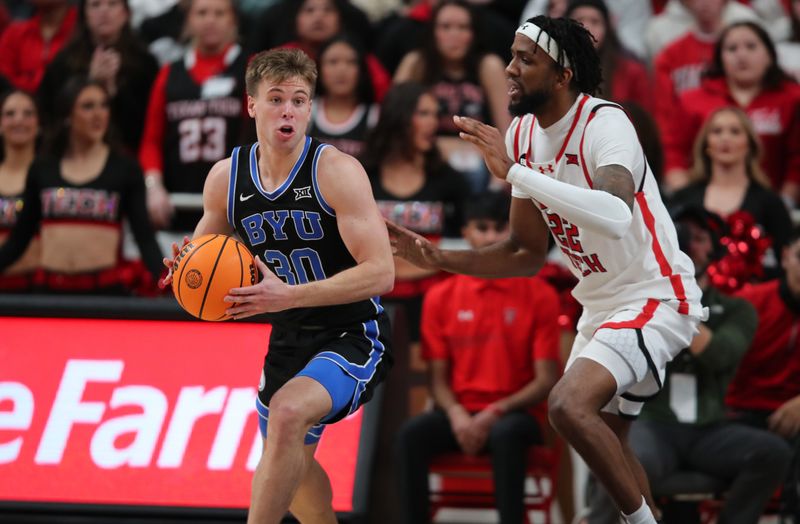 Jan 20, 2024; Lubbock, Texas, USA;  Brigham Young Cougars guard Dallin Hall (30) looks to pass the ball against Texas Tech Red Raiders forward Warren Washington (22) in the second half at United Supermarkets Arena. Mandatory Credit: Michael C. Johnson-USA TODAY Sports