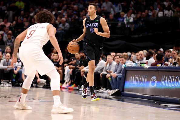 DALLAS, TEXAS - DECEMBER 27: Dante Exum #0 of the Dallas Mavericks dribbles the ball up court against the Cleveland Cavaliers in the second half at American Airlines Center on December 27, 2023 in Dallas, Texas. NOTE TO USER: User expressly acknowledges and agrees that, by downloading and or using this photograph, User is consenting to the terms and conditions of the Getty Images License Agreement. (Photo by Tim Heitman/Getty Images)