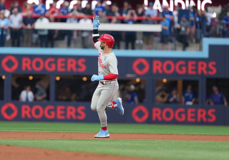 Jun 3, 2025; Toronto, Ontario, CAN; Philadelphia Phillies first baseman Bryce Harper (3) celebrates after hitting a home run against the Toronto Blue Jays during the first inning at Rogers Centre. Mandatory Credit: Nick Turchiaro-Imagn Images