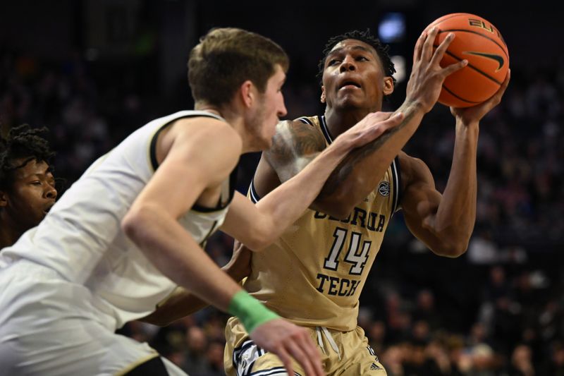 Feb 11, 2023; Winston-Salem, North Carolina, USA; Georgia Tech Yellow Jackets forward Jalon Moore (14) controls the ball against Wake Forest Demon Deacons forward Andrew Carr (11) during the second half at Lawrence Joel Veterans Memorial Coliseum. Mandatory Credit: William Howard-USA TODAY Sports