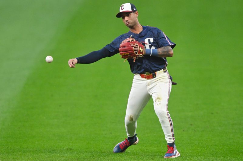 Sep 12, 2025; Cleveland, Ohio, USA; Cleveland Guardians second baseman Brayan Rocchio (4) throws to first base in the first inning against the Chicago White Sox at Progressive Field. Mandatory Credit: David Richard-Imagn Images