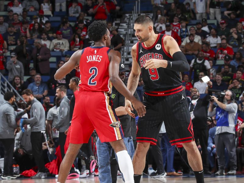 NEW ORLEANS, LA - OCTOBER 23: Nikola Vucevic #9 of the Chicago Bulls greets Herbert Jones #2 of the New Orleans Pelicans before the game on October 23, 2024 at the Smoothie King Center in New Orleans, Louisiana. NOTE TO USER: User expressly acknowledges and agrees that, by downloading and or using this Photograph, user is consenting to the terms and conditions of the Getty Images License Agreement. Mandatory Copyright Notice: Copyright 2024 NBAE (Photo by Layne Murdoch Jr./NBAE via Getty Images)