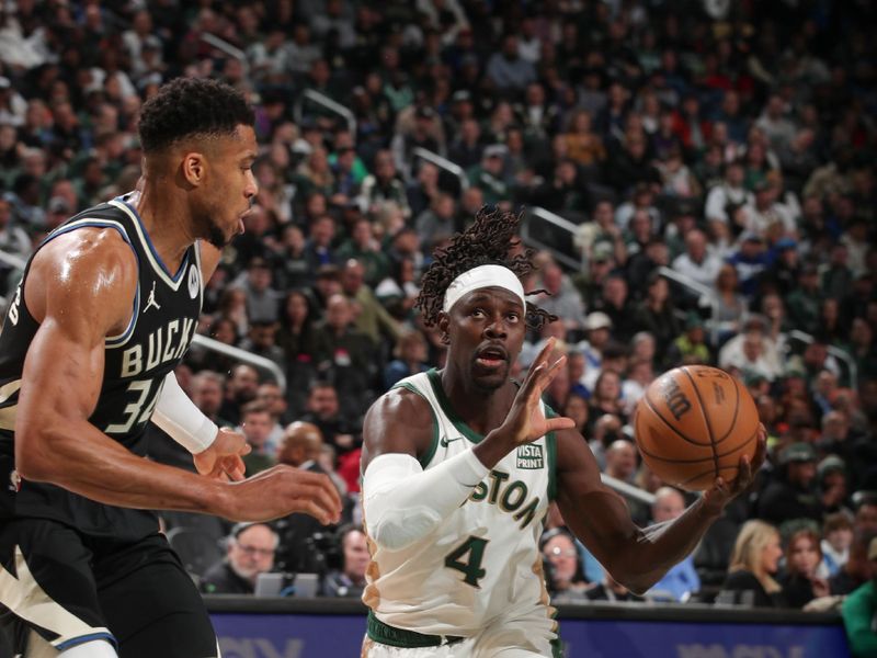 MILWAUKEE, WI - JANUARY 11:  Jrue Holiday #4 of the Boston Celtics goes to the basket during the game on January 11, 2024 at the Fiserv Forum Center in Milwaukee, Wisconsin. NOTE TO USER: User expressly acknowledges and agrees that, by downloading and or using this Photograph, user is consenting to the terms and conditions of the Getty Images License Agreement. Mandatory Copyright Notice: Copyright 2024 NBAE (Photo by Gary Dineen/NBAE via Getty Images).