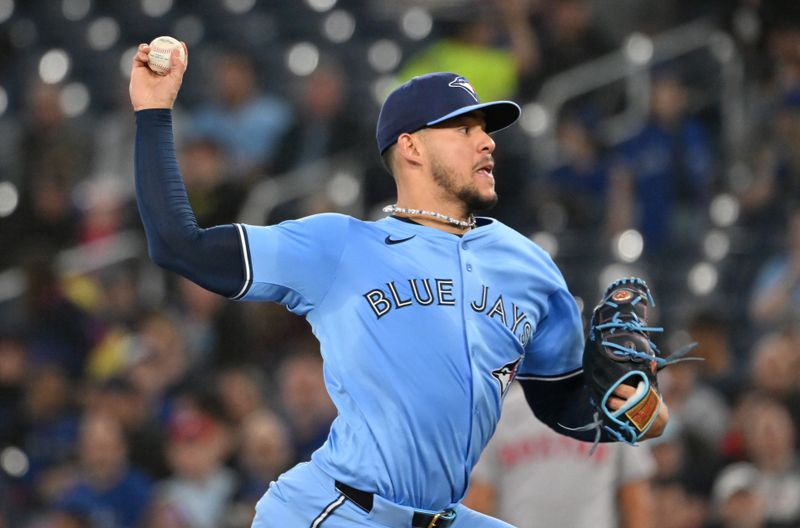 May 1, 2025; Toronto, Ontario, CAN;  Toronto Blue Jays starting pitcher Jose Berrios (17) delivers a pitch against the Boston Red Sox in the first inning at Rogers Centre. Mandatory Credit: Dan Hamilton-Imagn Images