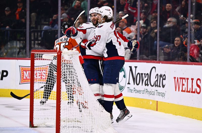 Dec 14, 2023; Philadelphia, Pennsylvania, USA; Washington Capitals right wing Tom Wilson (43) celebrates a goal with center Dylan Strome (17) against the Philadelphia Flyers in the second period at Wells Fargo Center. Mandatory Credit: Kyle Ross-USA TODAY Sports