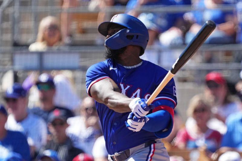 Mar 9, 2024; Phoenix, Arizona, USA; Texas Rangers right fielder Adolis Garcia (53) bats against the Los Angeles Dodgers during the first inning at Camelback Ranch-Glendale. Mandatory Credit: Joe Camporeale-USA TODAY Sports