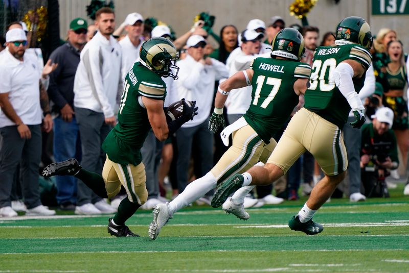 Nov 18, 2023; Fort Collins, Colorado, USA;  Colorado State Rams defensive back Henry Blackburn (11) heads upfield with an interception at Sonny Lubick Field at Canvas Stadium. Mandatory Credit: Michael Madrid-USA TODAY Sports