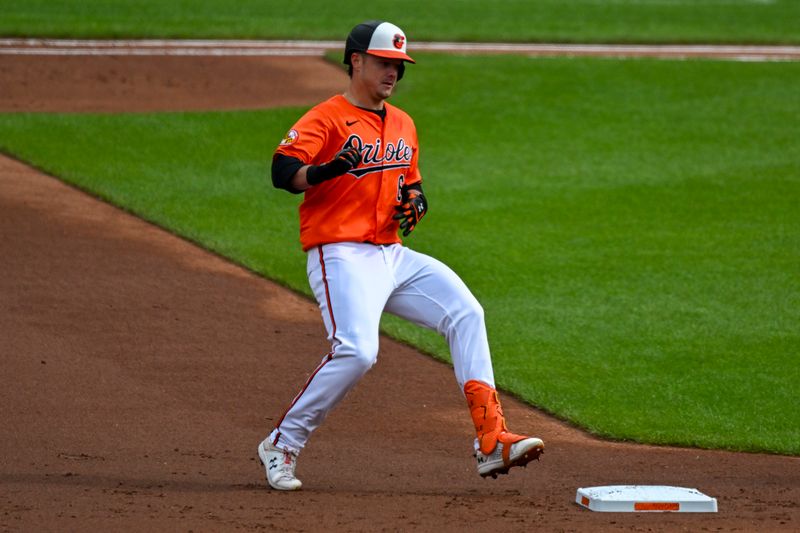 May 11, 2024; Baltimore, Maryland, USA; Baltimore Orioles first baseman Ryan Mountcastle (6) reaches second base on a 3i] double against the Arizona Diamondbacks  at Oriole Park at Camden Yards. Mandatory Credit: Tommy Gilligan-USA TODAY Sports