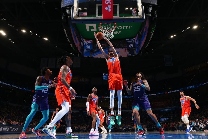 OKLAHOMA CITY, OK - FEBRUARY 2:  Chet Holmgren #7 of the Oklahoma City Thunder grabs the rebound during the game on February 2, 2024 at Paycom Arena in Oklahoma City, Oklahoma. NOTE TO USER: User expressly acknowledges and agrees that, by downloading and or using this photograph, User is consenting to the terms and conditions of the Getty Images License Agreement. Mandatory Copyright Notice: Copyright 2024 NBAE (Photo by Zach Beeker/NBAE via Getty Images)