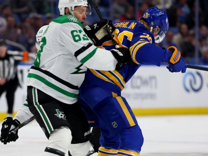 Oct 22, 2024; Buffalo, New York, USA;  Buffalo Sabres defenseman Rasmus Dahlin (26) checks Dallas Stars right wing Evgenii Dadonov (63) as he goes for a loose puck during the first period at KeyBank Center. Mandatory Credit: Timothy T. Ludwig-Imagn Images