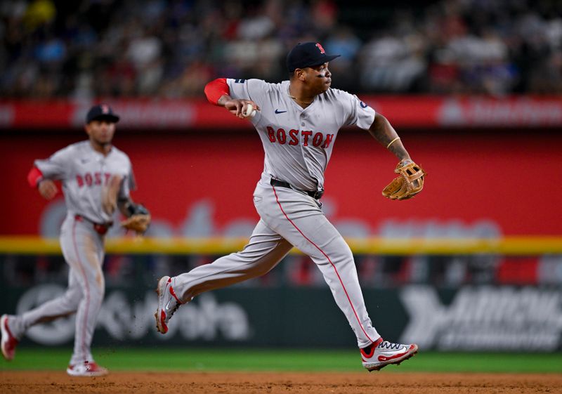 Aug 3, 2024; Arlington, Texas, USA;  Boston Red Sox third baseman Rafael Devers (11) throws to first base during the eighth inning against the Texas Rangers at Globe Life Field. Mandatory Credit: Jerome Miron-USA TODAY Sports