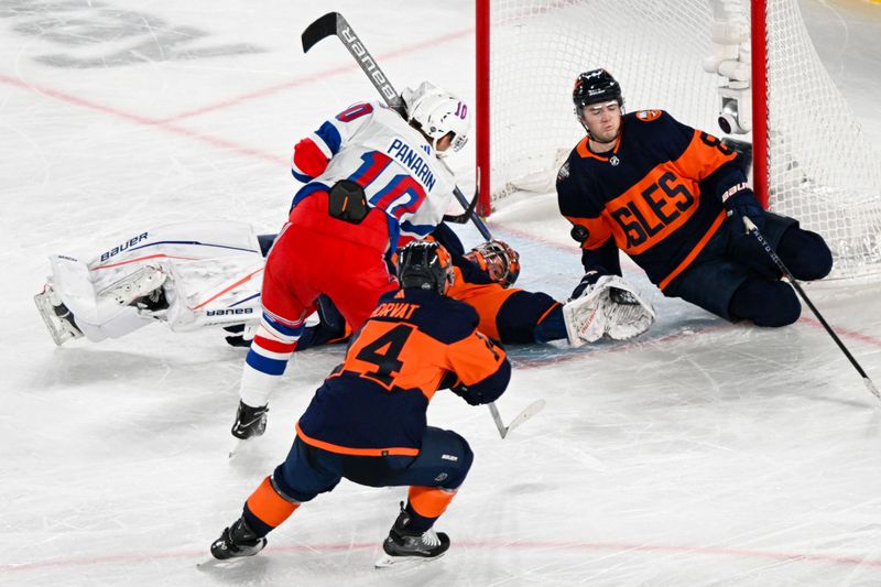 Feb 18, 2024; East Rutherford, New Jersey, USA;  New York Islanders defenseman Noah Dobson (8) makes a save against New York Rangers left wing Artemi Panarin (10) during the overtime period in a Stadium Series ice hockey game at MetLife Stadium. Mandatory Credit: Dennis Schneidler-USA TODAY Sports