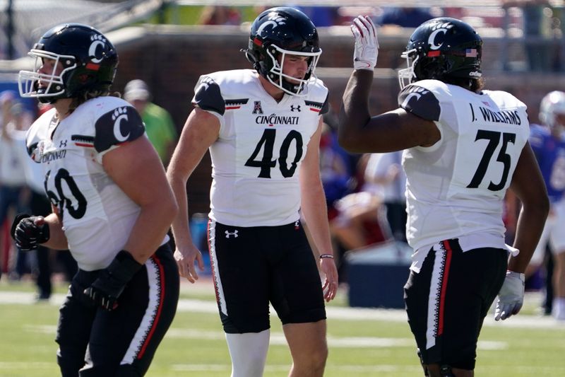 Oct 22, 2022; Dallas, Texas, USA; Cincinnati Bearcats place kicker Ryan Coe (40) is congratulated by offensive lineman John Williams (75) after making one of his five field goals during the second half against the Southern Methodist Mustangs at Gerald J. Ford Stadium. Mandatory Credit: Raymond Carlin III-USA TODAY Sports