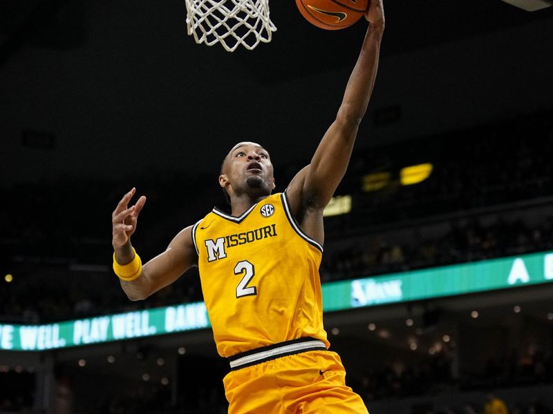 Jan 20, 2024; Columbia, Missouri, USA; Missouri Tigers guard Tamar Bates (2) shoots a layup against Florida Gators guard Riley Kugel (2) during the first half at Mizzou Arena. Mandatory Credit: Jay Biggerstaff-USA TODAY Sports