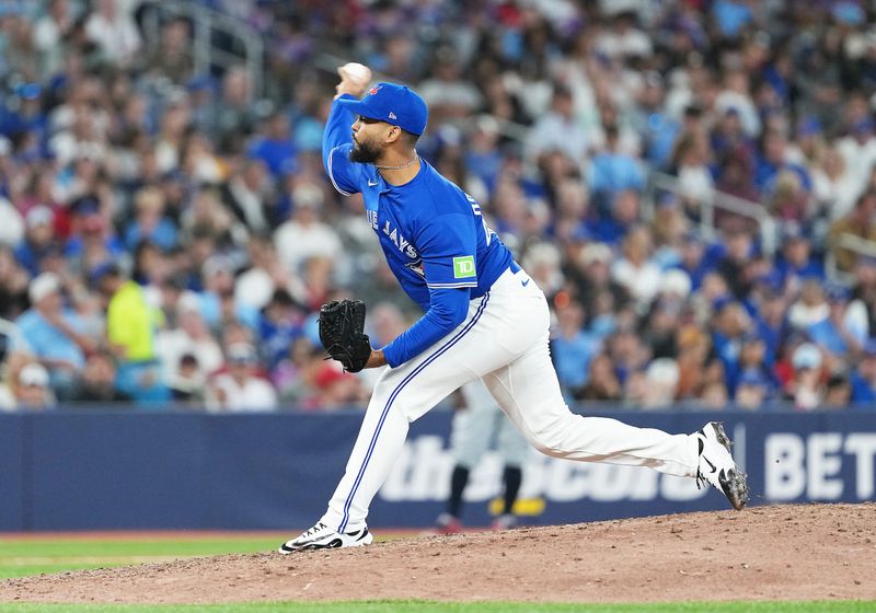 Aug 27, 2025; Toronto, Ontario, CAN; Toronto Blue Jays relief pitcher Seranthony Domínguez (48) throws a pitch against the Minnesota Twins during the eighth inning at Rogers Centre. Mandatory Credit: Nick Turchiaro-Imagn Images