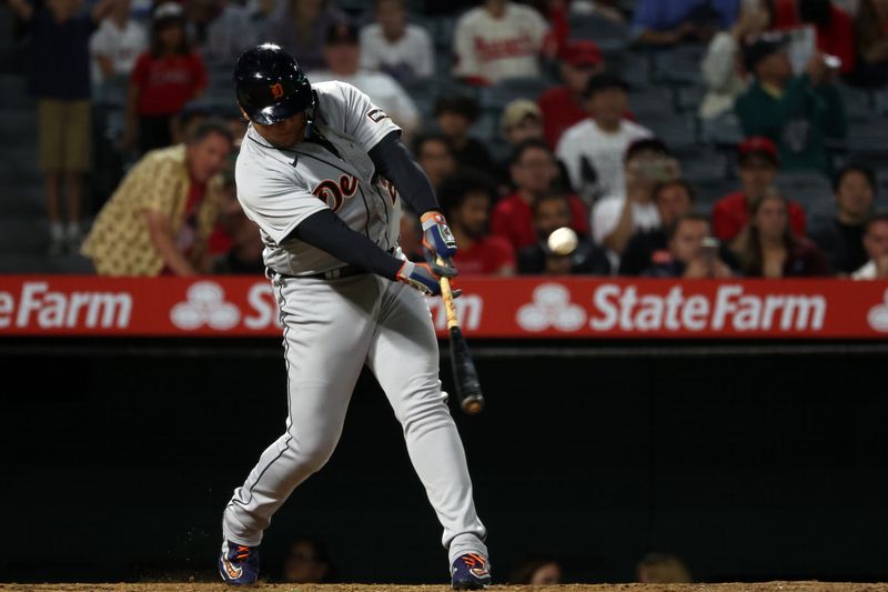 Sep 16, 2023; Anaheim, California, USA;  Detroit Tigers designated hitter Miguel Cabrera (24) hits an RBI single during the tenth inning against the Los Angeles Angels at Angel Stadium. Mandatory Credit: Kiyoshi Mio-USA TODAY Sports