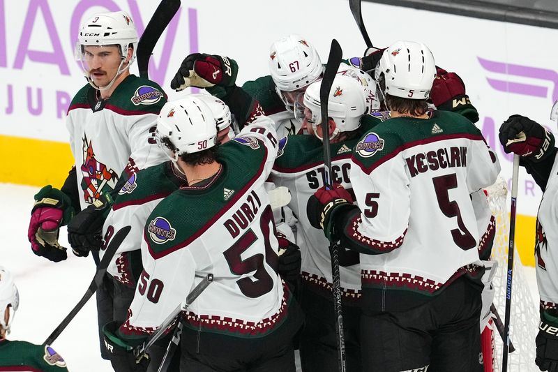 Nov 25, 2023; Las Vegas, Nevada, USA; Arizona Coyotes players celebrate after defeating the Vegas Golden Knights at T-Mobile Arena. Mandatory Credit: Stephen R. Sylvanie-USA TODAY Sports