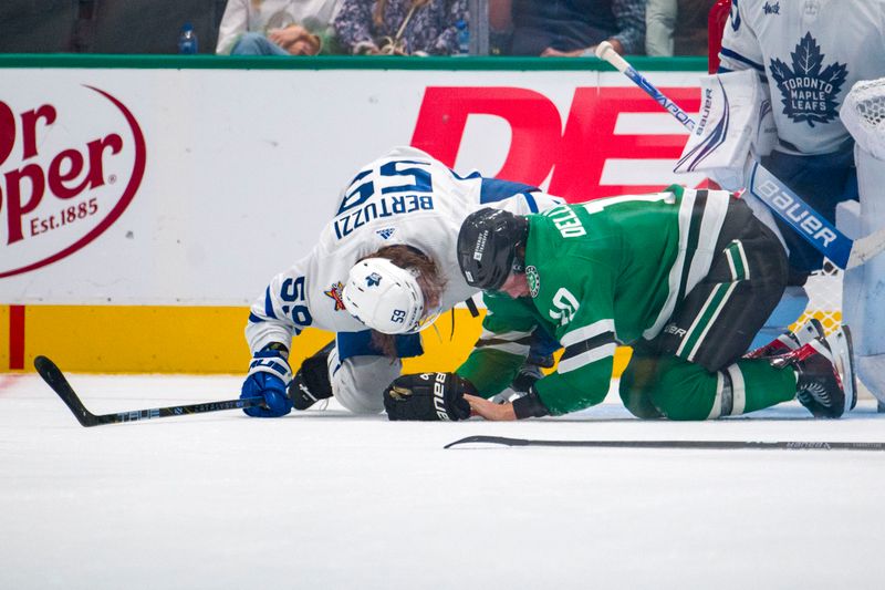 Oct 26, 2023; Dallas, Texas, USA; Toronto Maple Leafs left wing Tyler Bertuzzi (59) checks on Dallas Stars center Ty Dellandrea (10) after Dellandrea is injured on the ice during the third period at the American Airlines Center. Mandatory Credit: Jerome Miron-USA TODAY Sports