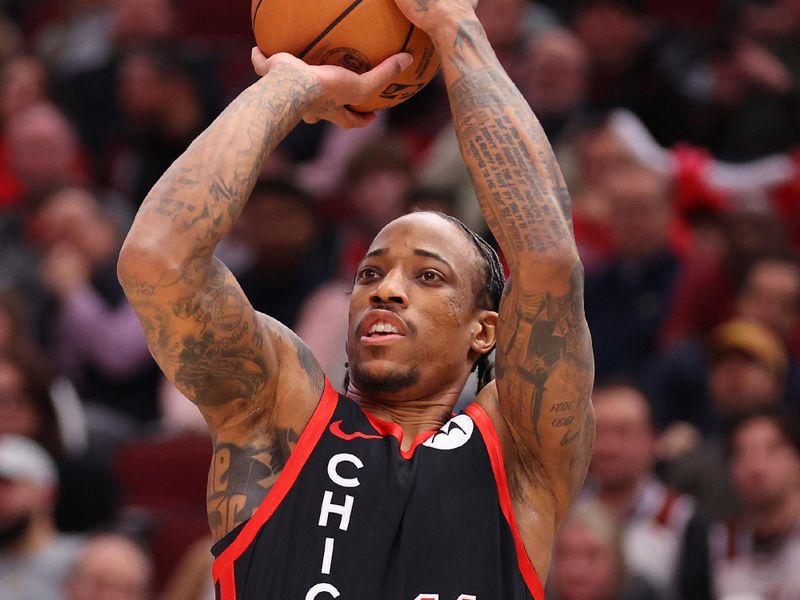 CHICAGO, ILLINOIS - JANUARY 30: DeMar DeRozan #11 of the Chicago Bulls shoots a three pointer against the Toronto Raptors during the first half at the United Center on January 30, 2024 in Chicago, Illinois. NOTE TO USER: User expressly acknowledges and agrees that, by downloading and or using this photograph, User is consenting to the terms and conditions of the Getty Images License Agreement.  (Photo by Michael Reaves/Getty Images)