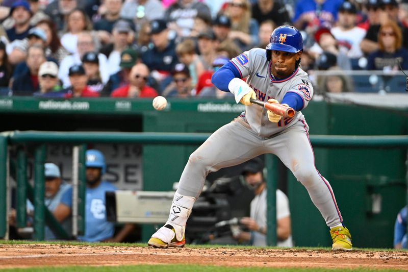 Apr 26, 2025; Washington, District of Columbia, USA; New York Mets shortstop Francisco Lindor (12) singles against the Washington Nationals during the fifth inning at Nationals Park. Mandatory Credit: Brad Mills-Imagn Images