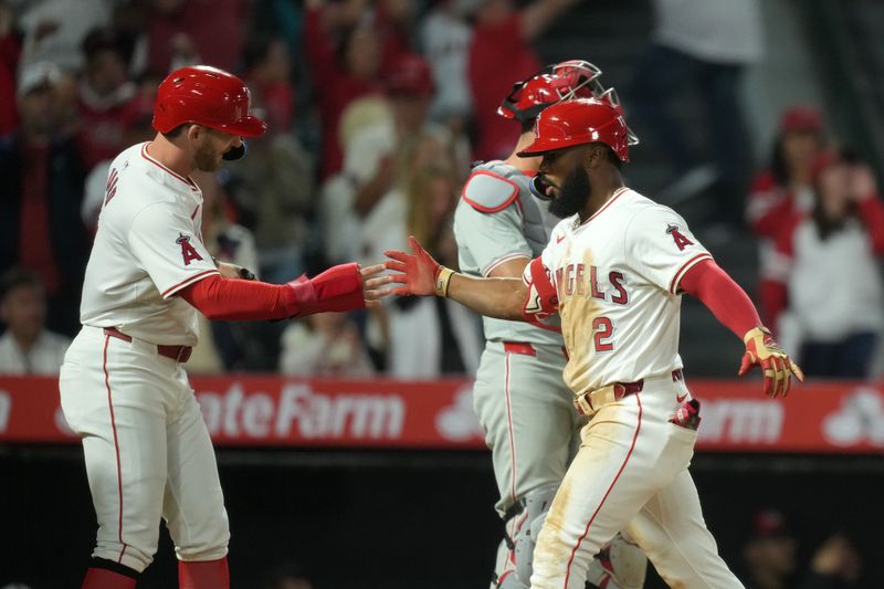 Apr 30, 2024; Anaheim, California, USA; Los Angeles Angels third baseman Luis Rengifo (2) celebrates with left fielder Taylor Ward (3) after hitting a three-run home run in the sixth inning against the Philadelphia Phillies at Angel Stadium. Mandatory Credit: Kirby Lee-USA TODAY Sports