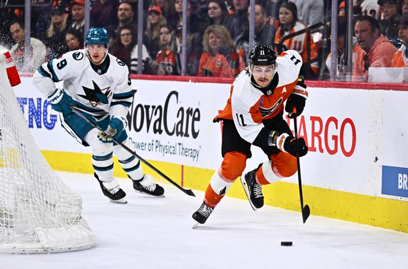 Mar 12, 2024; Philadelphia, Pennsylvania, USA; Philadelphia Flyers right wing Travis Konecny (11) reaches for the puck against the San Jose Sharks in the first period at Wells Fargo Center. Mandatory Credit: Kyle Ross-USA TODAY Sports