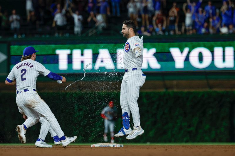 Aug 1, 2024; Chicago, Illinois, USA; Chicago Cubs outfielder Mike Tauchman (40) celebrates with teammates his walk-off single against the St. Louis Cardinals during the ninth inning at Wrigley Field. Mandatory Credit: Kamil Krzaczynski-USA TODAY Sports
