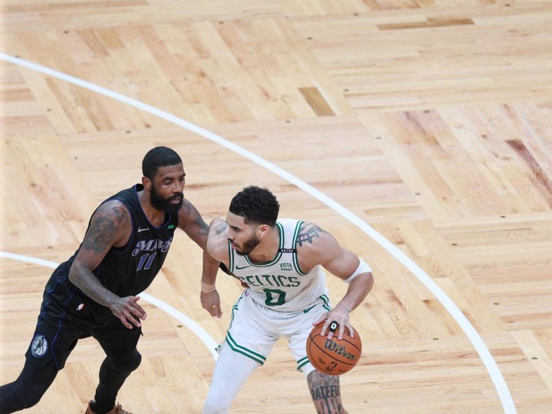 BOSTON, MA - JUNE 6: Jayson Tatum #0 of the Boston Celtics handles the ball during the game  against Kyrie Irving #11 of the Dallas Mavericks during Game 1 of the 2024 NBA Finals on June 6, 2024 at the TD Garden in Boston, Massachusetts. NOTE TO USER: User expressly acknowledges and agrees that, by downloading and or using this photograph, User is consenting to the terms and conditions of the Getty Images License Agreement. Mandatory Copyright Notice: Copyright 2024 NBAE  (Photo by Chris Marion/NBAE via Getty Images)