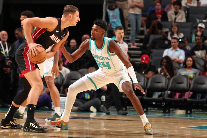 CHARLOTTE, NC - OCTOBER 8: Brandon Miller #24 of the Charlotte Hornets plays defense during the game against the Miami Heat during a preseason game on October 8, 2024 at Spectrum Center in Charlotte, North Carolina. NOTE TO USER: User expressly acknowledges and agrees that, by downloading and or using this photograph, User is consenting to the terms and conditions of the Getty Images License Agreement. Mandatory Copyright Notice: Copyright 2024 NBAE (Photo by Kent Smith/NBAE via Getty Images)